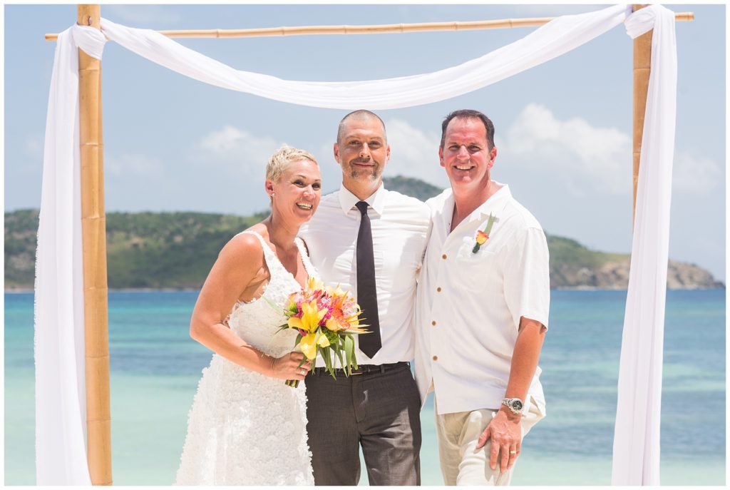 beach wedding with couple and minister