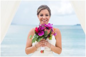 bride holding tropical bouquet